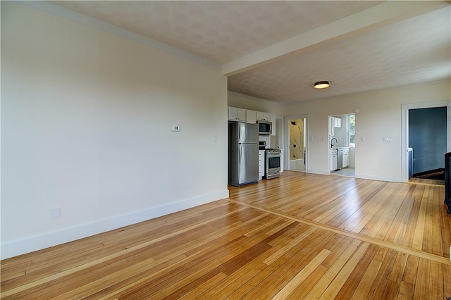 93 Naples Ave, Providence, RI 02908 - unfurnished living room with light wood-style flooring and baseboards