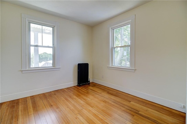 93 Naples Ave, Providence, RI 02908 - empty room featuring radiator heating unit, baseboards, and light wood-type flooring