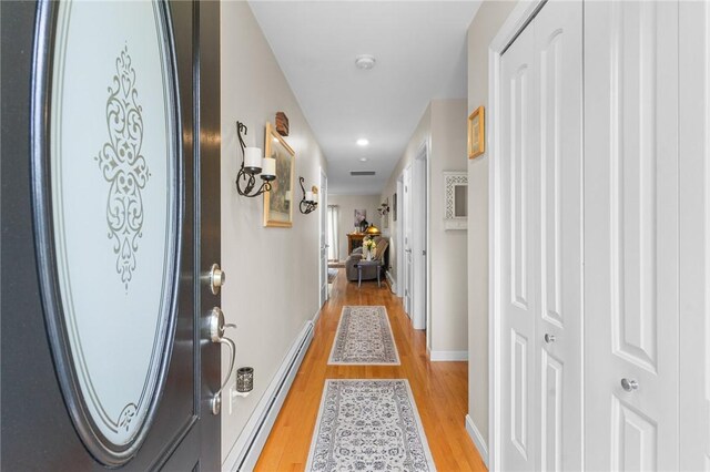 5 Leighas Ln, Coventry, RI 02816 - hallway featuring a baseboard radiator, light wood-type flooring, recessed lighting, and baseboards