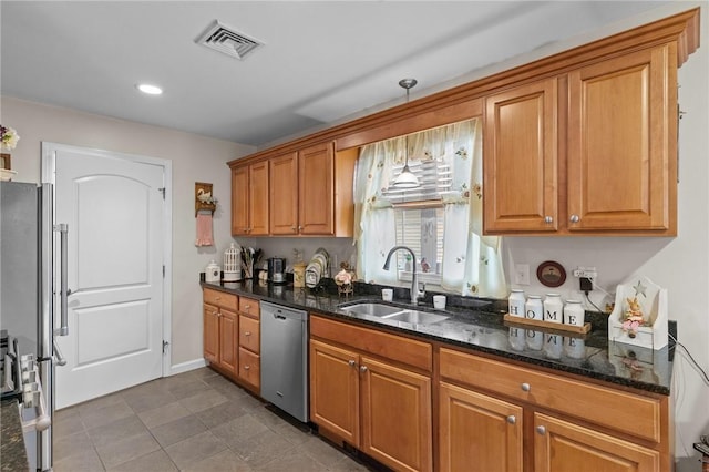 5 Leighas Ln, Coventry, RI 02816 - kitchen with appliances with stainless steel finishes, a sink, brown cabinetry, dark stone counters, and recessed lighting