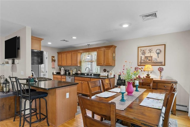 5 Leighas Ln, Coventry, RI 02816 - kitchen featuring a sink, a kitchen bar, light wood-style flooring, dark countertops, and recessed lighting