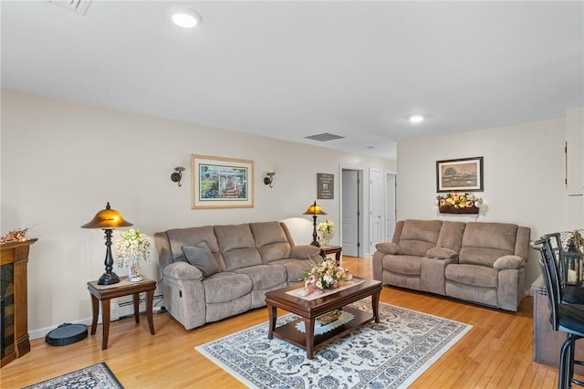 5 Leighas Ln, Coventry, RI 02816 - living area featuring light wood-style floors, recessed lighting, and a fireplace