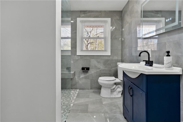 1300 Wallum Lake Rd, Burrillville, RI 02859 - bathroom featuring tile walls, toilet, vanity, and a shower