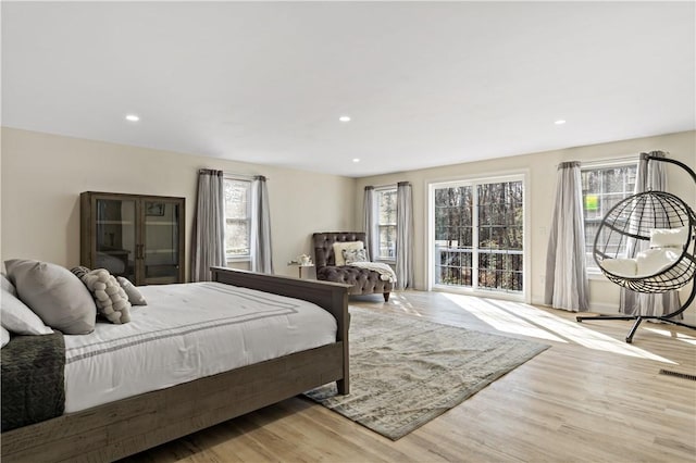 1300 Wallum Lake Rd, Burrillville, RI 02859 - bedroom with multiple windows, wood finished floors, and recessed lighting