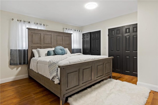 1300 Wallum Lake Rd, Burrillville, RI 02859 - bedroom with baseboards, two closets, and wood finished floors