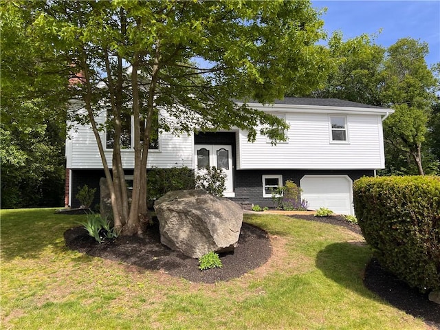 62 Lucille Dr, Woonsocket, RI 02895 - bi-level home featuring an attached garage and a front yard