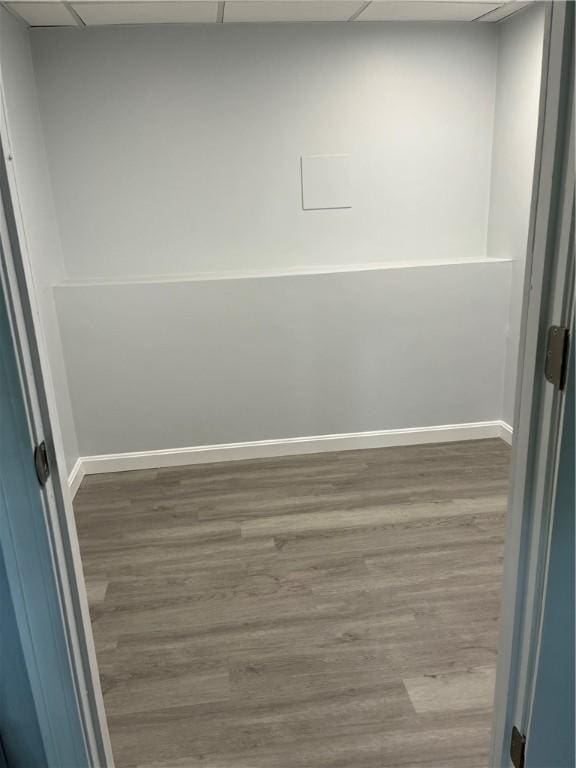 62 Lucille Dr, Woonsocket, RI 02895 - empty room featuring a paneled ceiling, wood finished floors, and baseboards