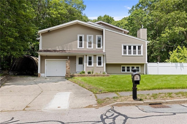 67 Highwood Dr, Coventry, RI 02816 - view of front of property with a garage, a chimney, and driveway