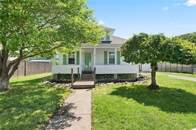 39 Camac St, Pawtucket, RI 02861 - view of property hidden behind natural elements featuring covered porch and roof with shingles