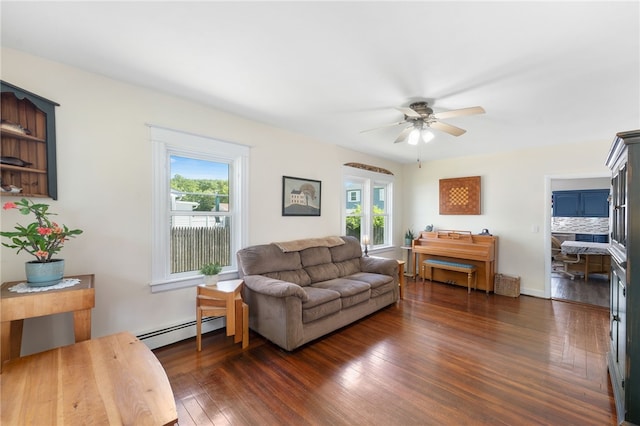 39 Camac St, Pawtucket, RI 02861 - living area with baseboard heating, plenty of natural light, ceiling fan, and dark wood-style floors