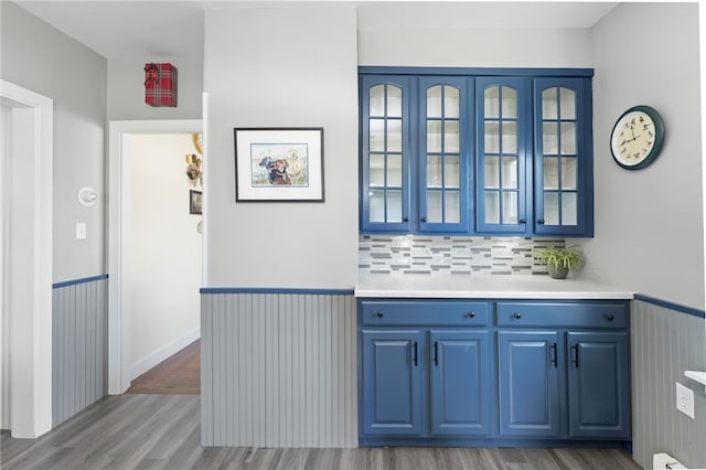 39 Camac St, Pawtucket, RI 02861 - bar area with light wood finished floors, backsplash, and baseboard heating