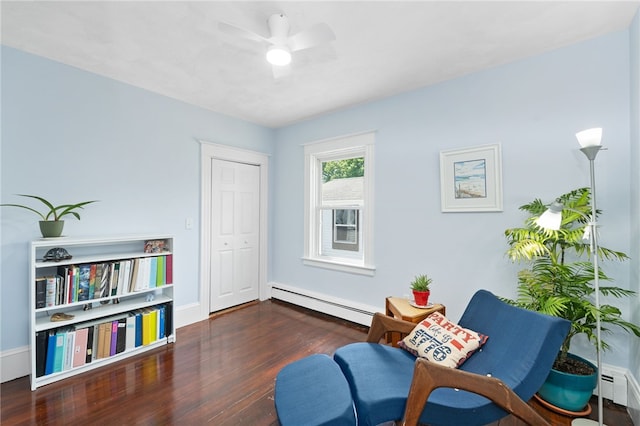 39 Camac St, Pawtucket, RI 02861 - living area with baseboard heating, wood finished floors, ceiling fan, and baseboards