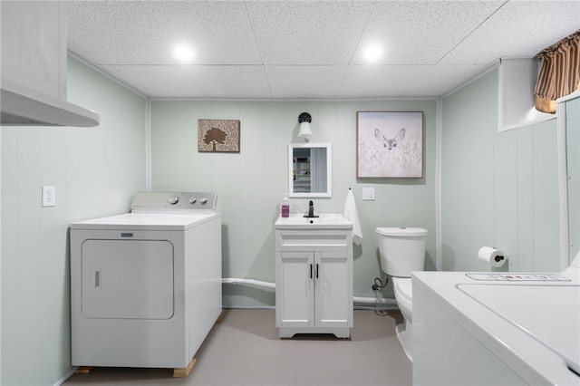 39 Camac St, Pawtucket, RI 02861 - washroom with baseboards, washer and clothes dryer, and tile patterned floors