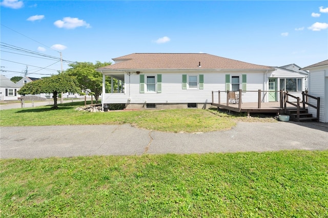 39 Camac St, Pawtucket, RI 02861 - rear view of property featuring a wooden deck and a lawn