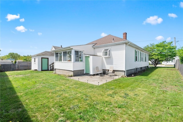 39 Camac St, Pawtucket, RI 02861 - back of house featuring a chimney, a patio area, and a sunroom