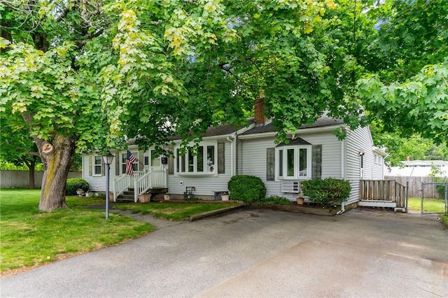 28 Ann Ln, North Kingstown, RI 02852 - view of front of house with a chimney