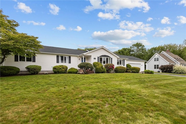 15 Womantam Ln, Cumberland, RI 02864 - single story home with a front lawn and an attached garage