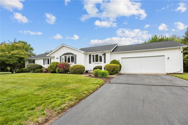 15 Womantam Ln, Cumberland, RI 02864 - ranch-style home with asphalt driveway, an attached garage, and a front yard