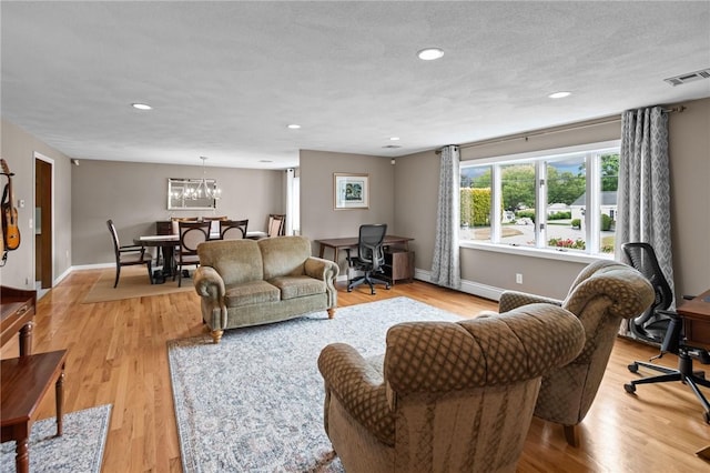 15 Womantam Ln, Cumberland, RI 02864 - living room featuring a desk, light wood-style flooring, baseboards, recessed lighting, and a chandelier