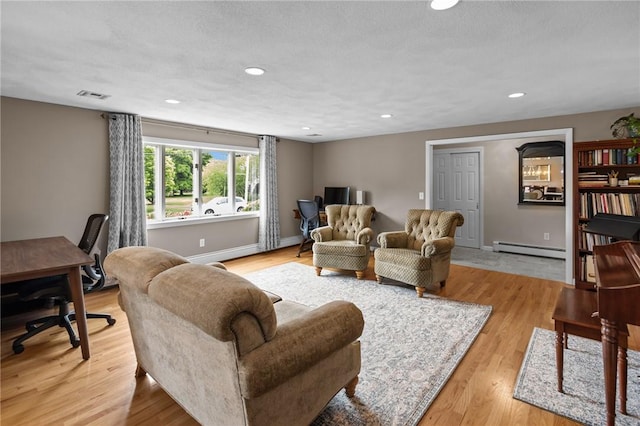15 Womantam Ln, Cumberland, RI 02864 - living area with a baseboard radiator, an office area, light wood-style flooring, recessed lighting, and baseboards