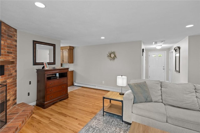 15 Womantam Ln, Cumberland, RI 02864 - living room featuring a fireplace, a baseboard radiator, light wood-style floors, baseboards, and recessed lighting