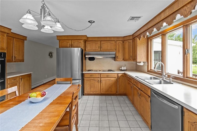 15 Womantam Ln, Cumberland, RI 02864 - kitchen featuring appliances with stainless steel finishes, range hood, a sink, a baseboard radiator, and light countertops