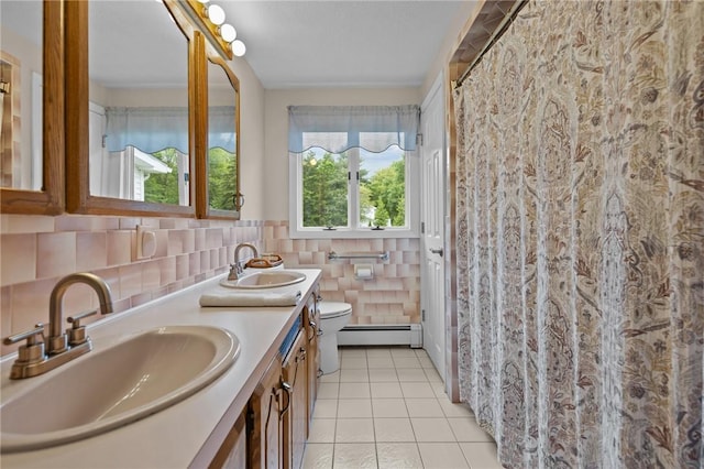 15 Womantam Ln, Cumberland, RI 02864 - bathroom with baseboard heating, toilet, double vanity, and tile patterned floors