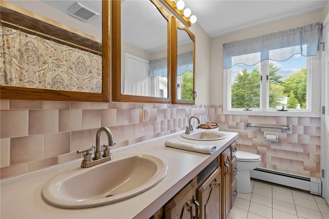 15 Womantam Ln, Cumberland, RI 02864 - bathroom featuring a baseboard radiator, double vanity, tile patterned floors, and toilet