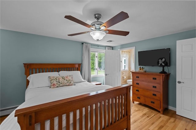 15 Womantam Ln, Cumberland, RI 02864 - bedroom featuring light wood-style flooring, a baseboard heating unit, ceiling fan, connected bathroom, and baseboards