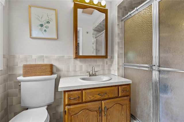 15 Womantam Ln, Cumberland, RI 02864 - full bathroom with tile walls, vanity, toilet, and a stall shower