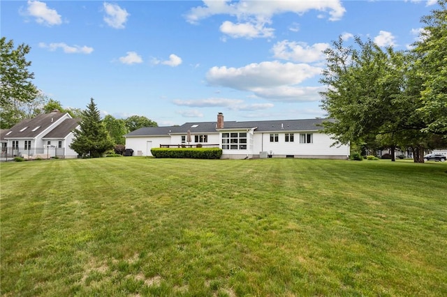 15 Womantam Ln, Cumberland, RI 02864 - rear view of property featuring a yard and a chimney