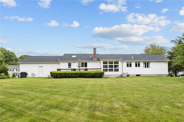 15 Womantam Ln, Cumberland, RI 02864 - rear view of house with a yard, a chimney, and a deck
