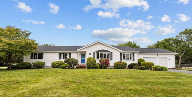 15 Womantam Ln, Cumberland, RI 02864 - ranch-style house featuring a garage, asphalt driveway, and a front lawn