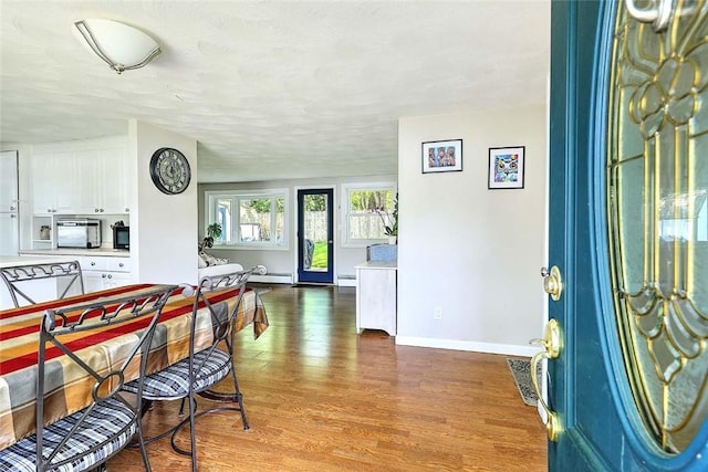 92 Chatworth Ave, Warwick, RI 02886 - dining area with wood finished floors and baseboards