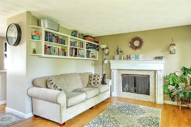 92 Chatworth Ave, Warwick, RI 02886 - living area with wood finished floors, a premium fireplace, and baseboards