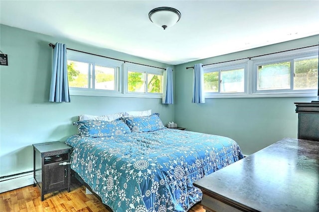 92 Chatworth Ave, Warwick, RI 02886 - bedroom with baseboard heating and wood finished floors