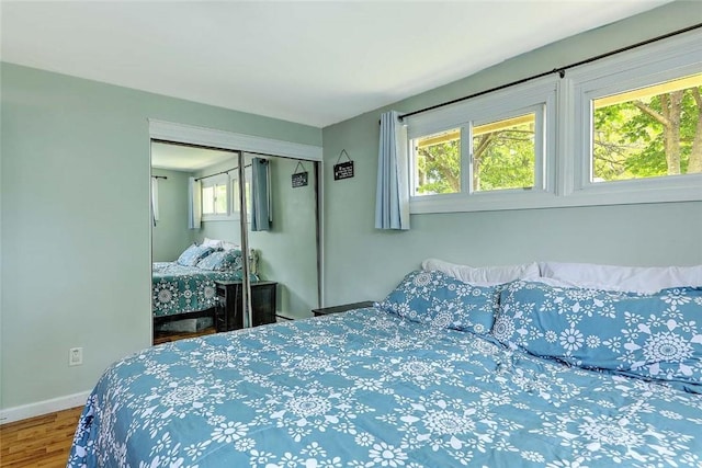 92 Chatworth Ave, Warwick, RI 02886 - bedroom featuring wood finished floors, a closet, and baseboards