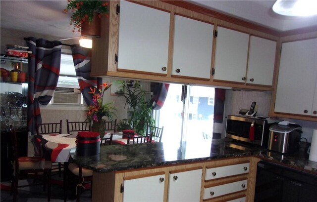 15 Ponderosa Dr, West Warwick, RI 02893 - kitchen with stainless steel microwave, dishwasher, white cabinets, and cooling unit