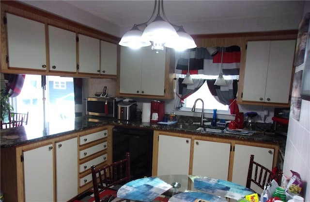 15 Ponderosa Dr, West Warwick, RI 02893 - kitchen featuring dishwasher, a sink, stainless steel microwave, hanging light fixtures, and a chandelier