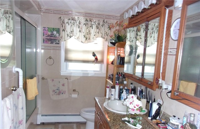 15 Ponderosa Dr, West Warwick, RI 02893 - bathroom with a baseboard heating unit, vanity, a shower stall, and toilet
