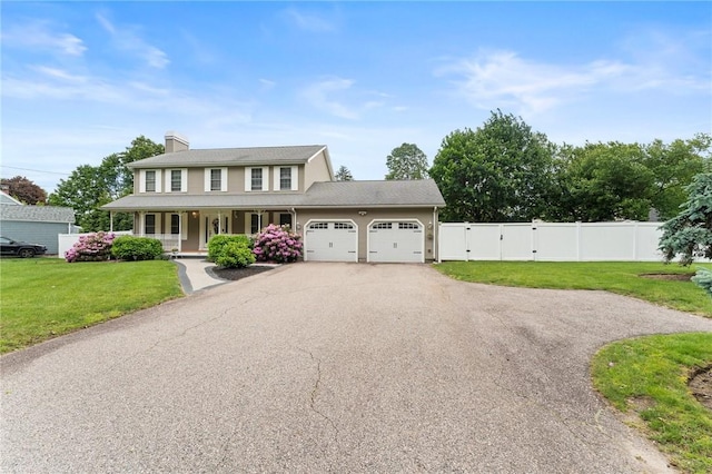 1710 Phenix Ave, Cranston, RI 02921 - view of front of property featuring a porch, an attached garage, driveway, a gate, and a chimney