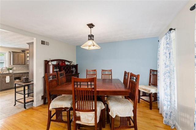 1710 Phenix Ave, Cranston, RI 02921 - dining area with light wood finished floors