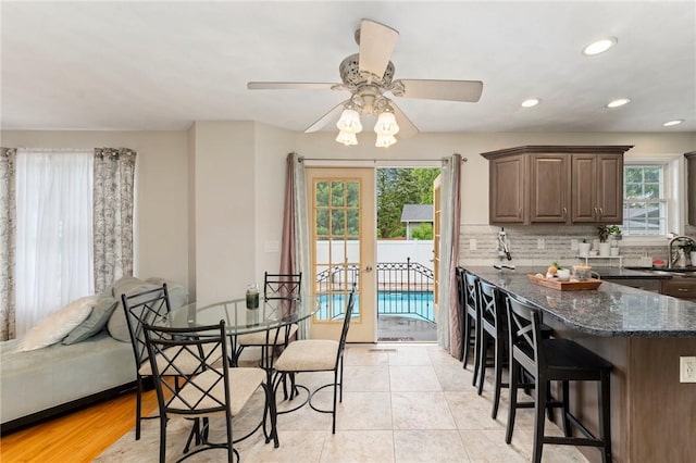 1710 Phenix Ave, Cranston, RI 02921 - dining space with plenty of natural light, a ceiling fan, recessed lighting, and light tile patterned flooring