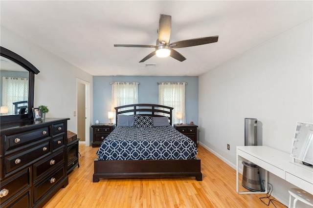 1710 Phenix Ave, Cranston, RI 02921 - bedroom with light wood finished floors, baseboards, and a ceiling fan
