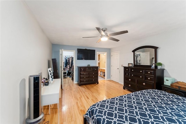 1710 Phenix Ave, Cranston, RI 02921 - bedroom featuring light wood-style flooring, a closet, a walk in closet, ceiling fan, and ensuite bath