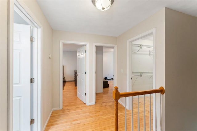1710 Phenix Ave, Cranston, RI 02921 - hall with light wood finished floors, an upstairs landing, and baseboards