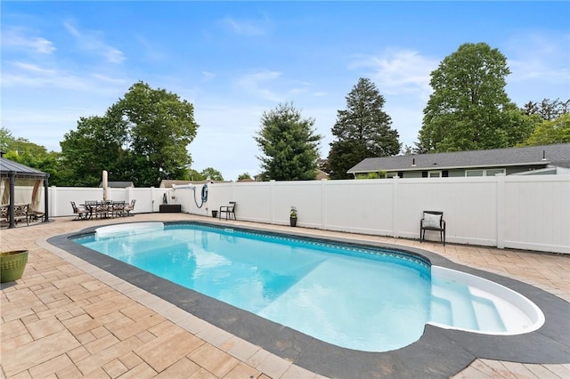 1710 Phenix Ave, Cranston, RI 02921 - view of swimming pool featuring a patio, a fenced backyard, a gazebo, and outdoor dining space