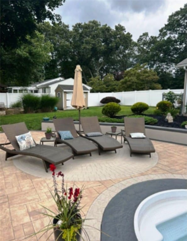 1710 Phenix Ave, Cranston, RI 02921 - fenced backyard featuring a patio area and view of scattered trees