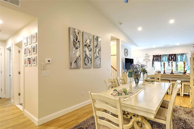 77 W Valley Cir Unit 77, West Warwick, RI 02893 - dining area featuring light wood finished floors, recessed lighting, baseboards, and lofted ceiling