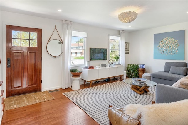 7 Maloney Ln, Middletown, RI 02842 - living area with plenty of natural light, light wood finished floors, baseboards, and recessed lighting
